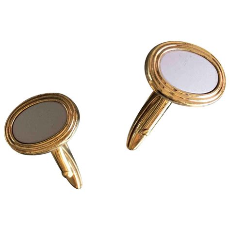 Boutons de manchette Dior pour Homme .